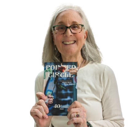Kristy Schnabel holding an issue of The Pointed Circle Literary Magazine